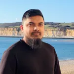 Shafayet Ahmad Kanon, photographed outdoors against a coastline.